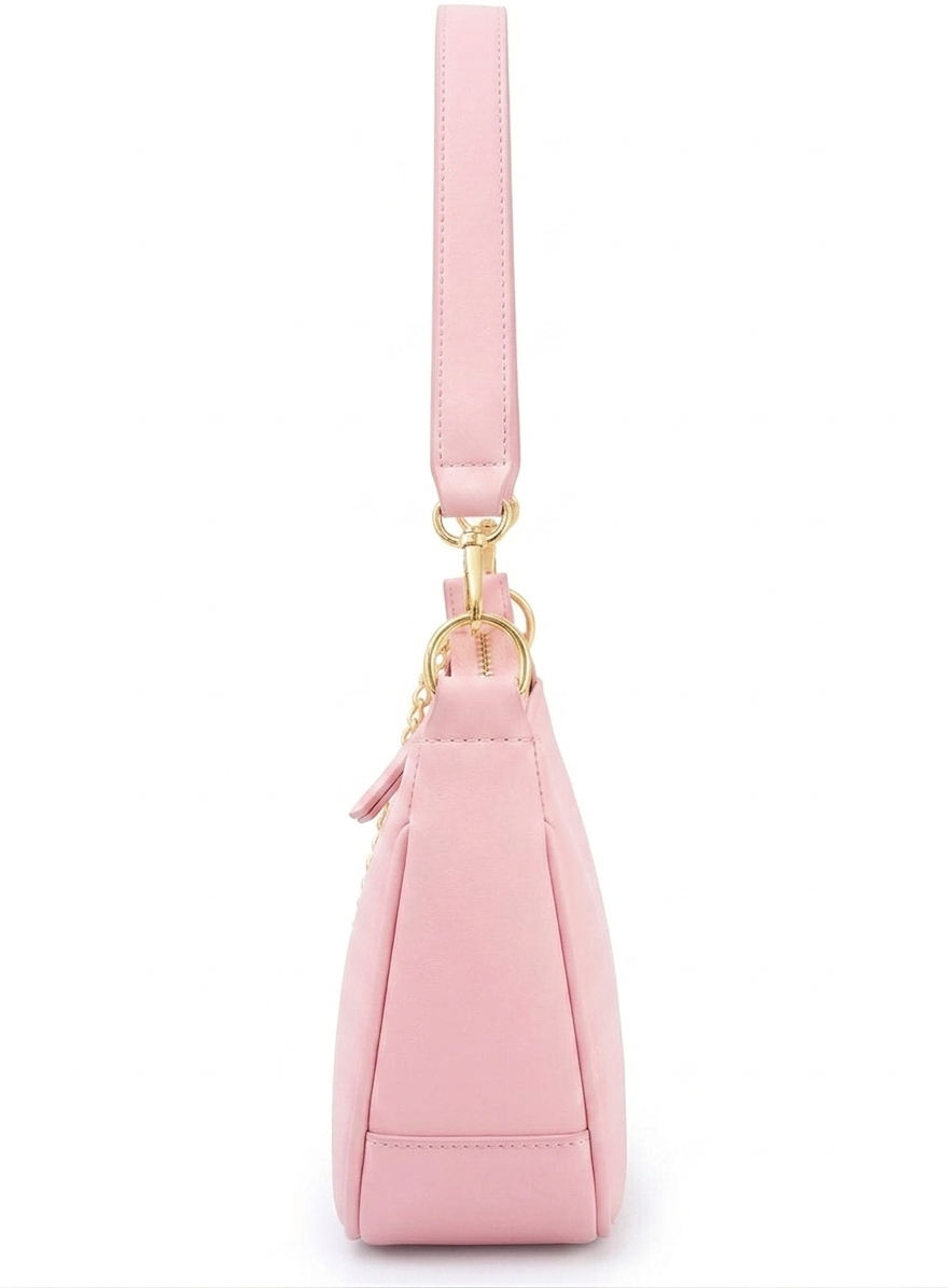 Pink handbag with a strap on a white background