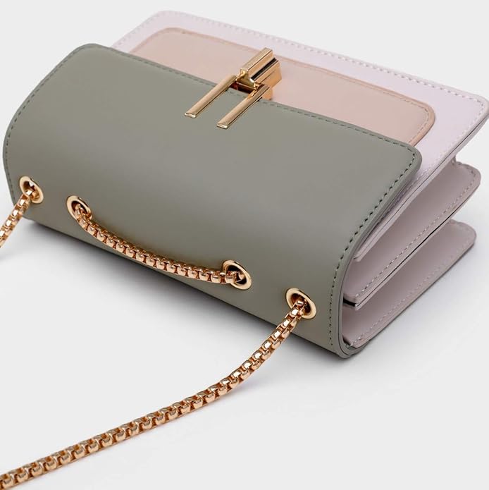 Green handbag with gold chain strap on a white background