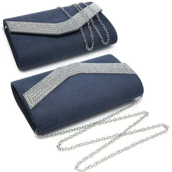 Two navy blue clutch bags with silver embellishments on a white background