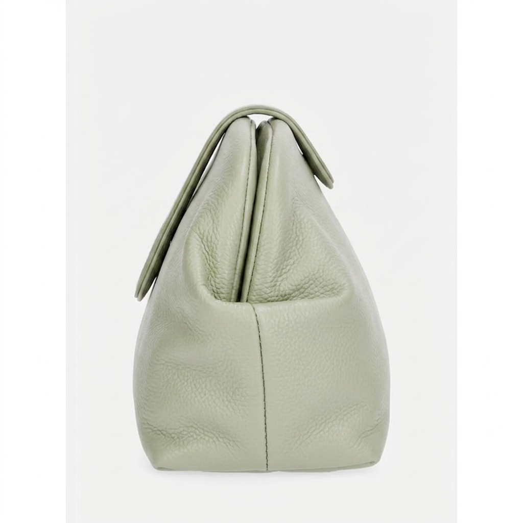 Light green leather handbag on a white background